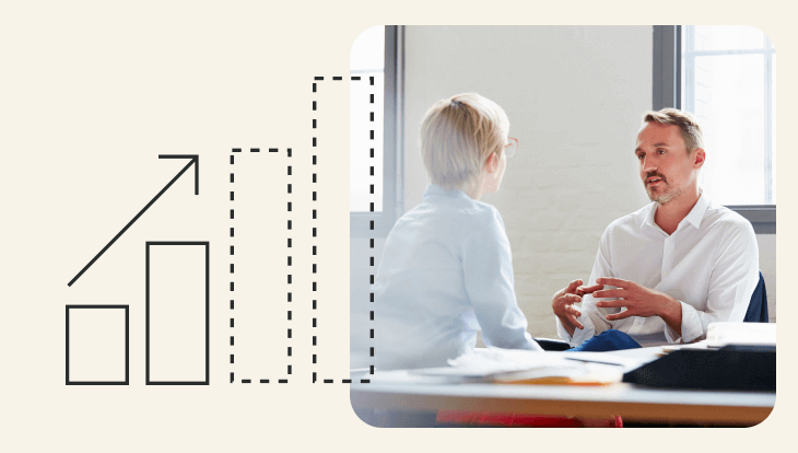 Financial forecasting - photo of two humans chatting across a desk plus bar graph image indicating an increase