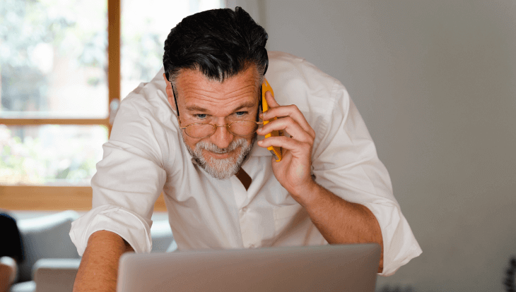 man on fun looking at computer for blog about quota relief