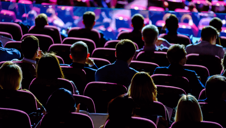 sales kickoff themes - image of audience watching stage