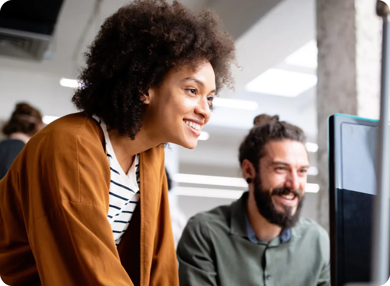 two people looking at desktop