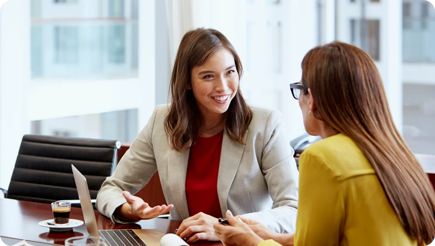 two women talking over work